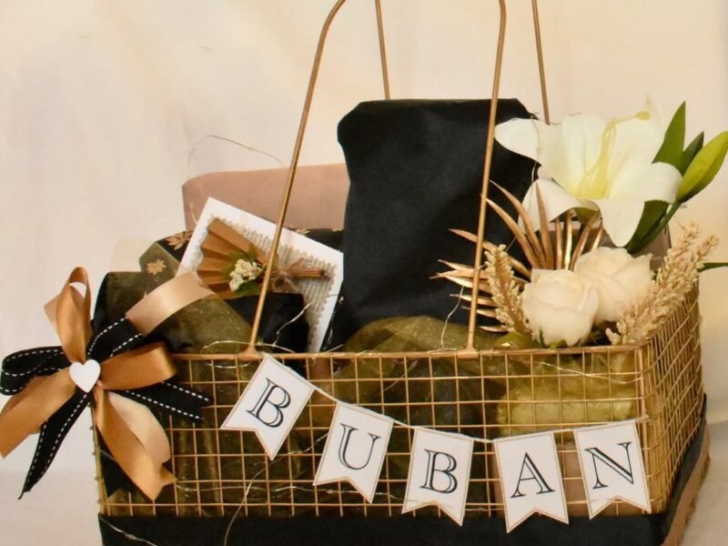 Luxury gold basket hamper for a man with flowers and gifts