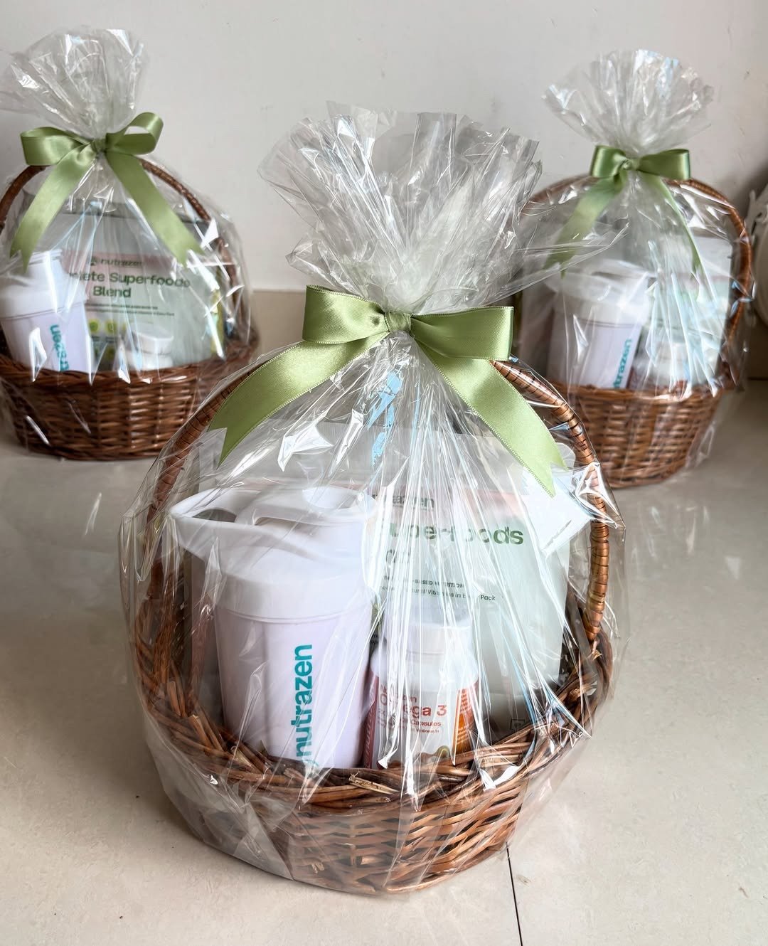 Gift baskets wrapped in cellophane with ribbon bows