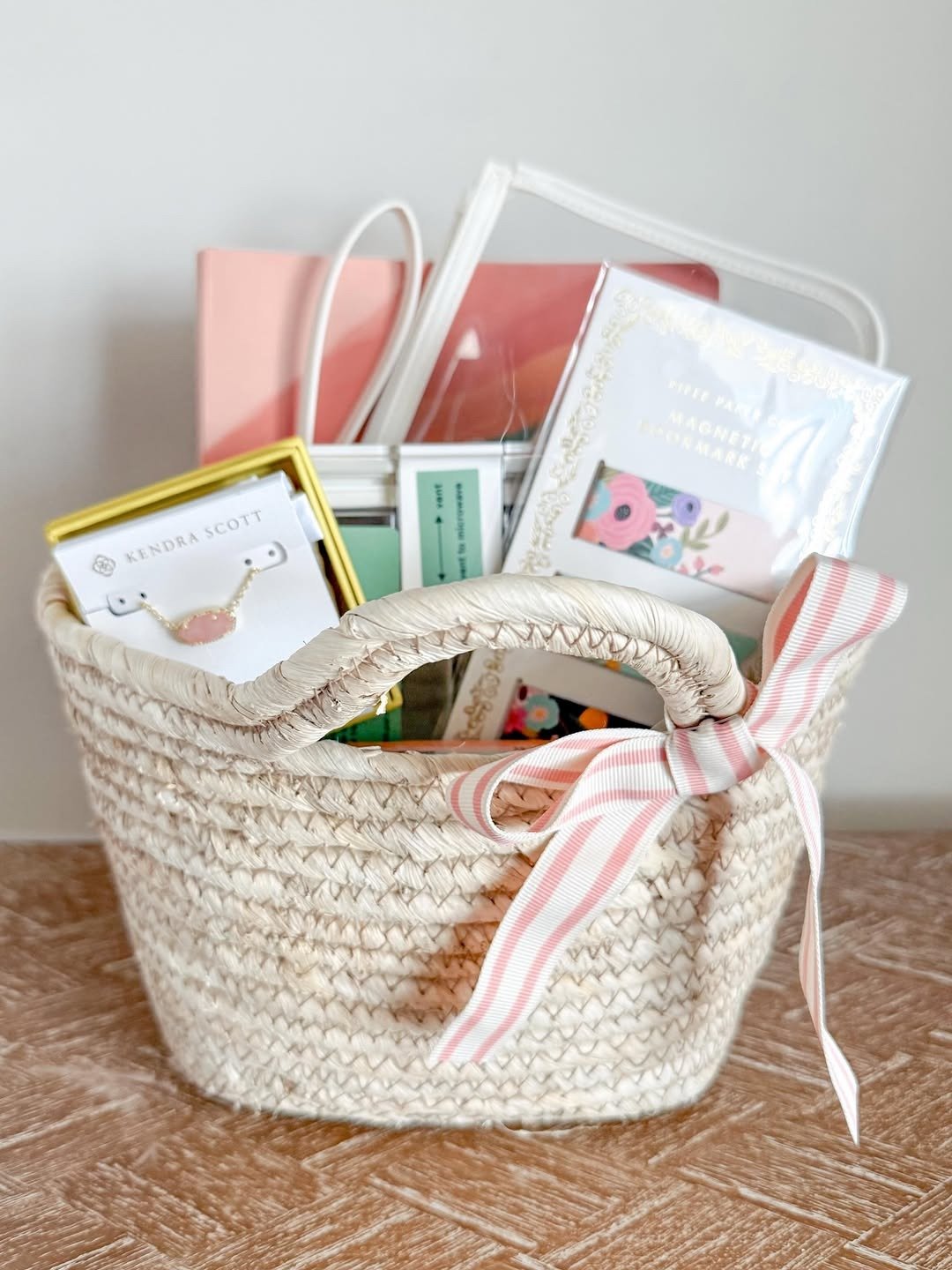 Finished straw gift basket with ribbon and cards inside