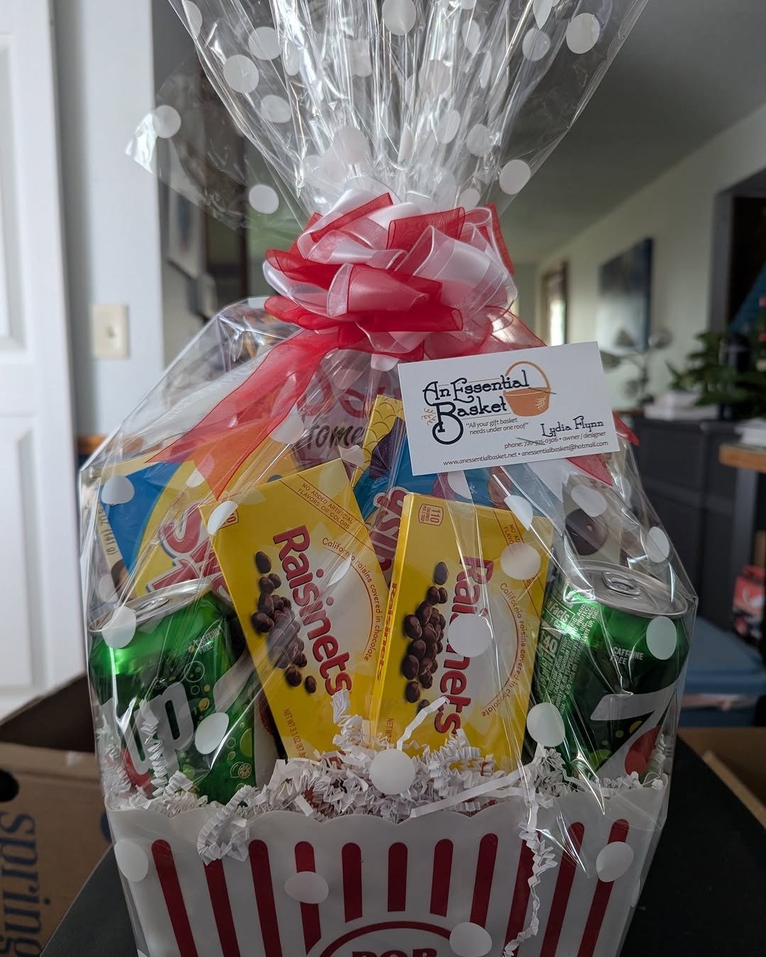 Popcorn and candy movie night gift basket in cellophane