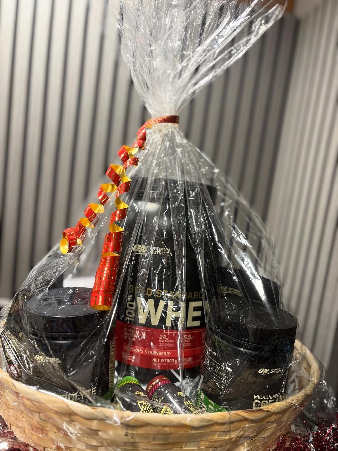 Fitness gift basket with protein tubs and shots