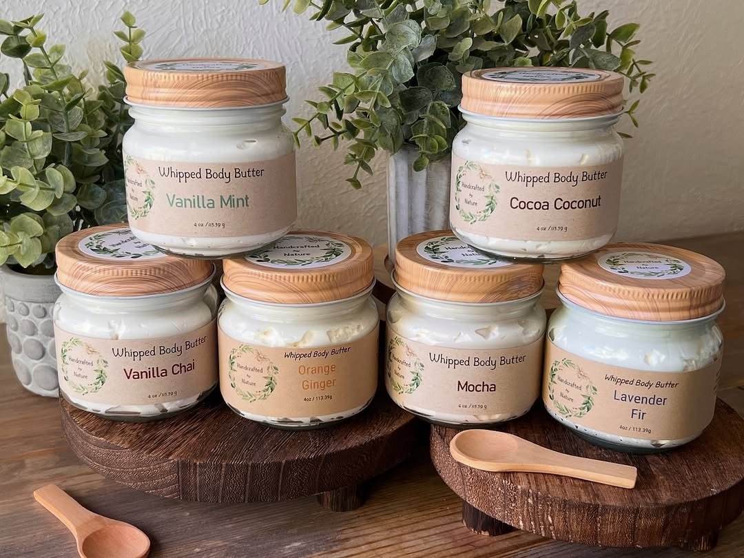 Whipped body butter jars on wooden boards