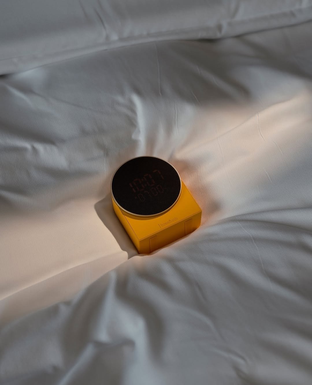 Sunrise wake-up light glowing on bed