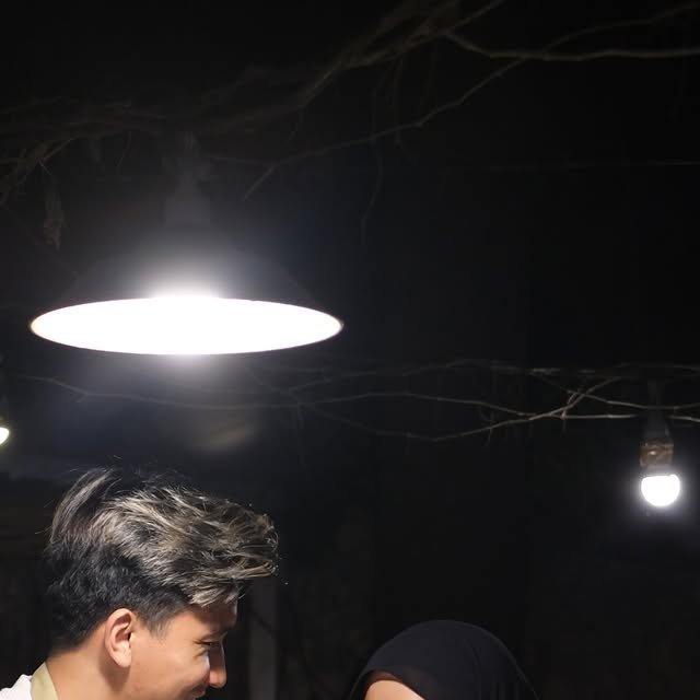 Couple making homemade pizza together in a flour-dusted kitchen