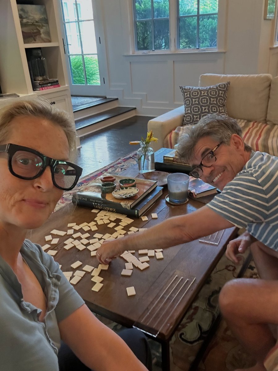Couple playing a tabletop game together at a table