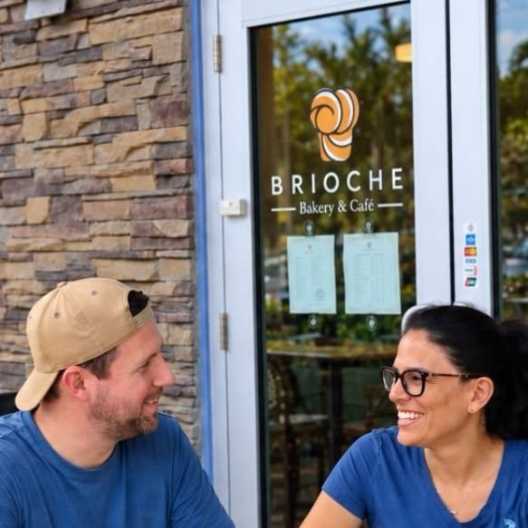 Couple enjoying pastries and coffee at a neighborhood bakery