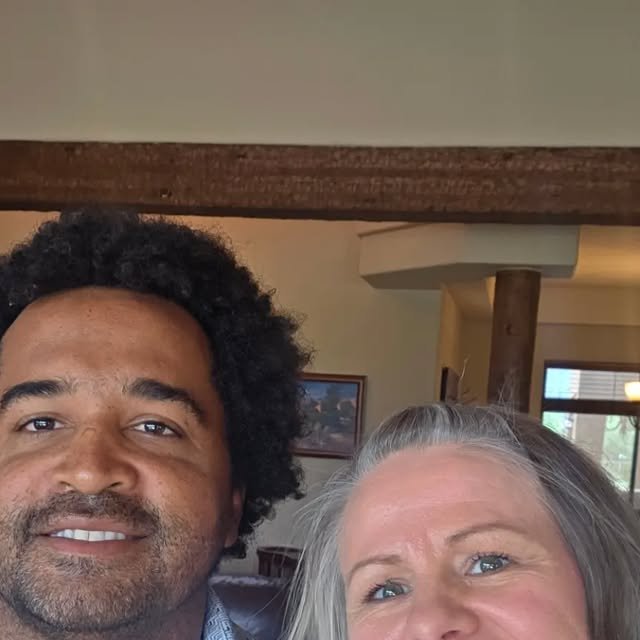 Couple taking a selfie while touring an open house