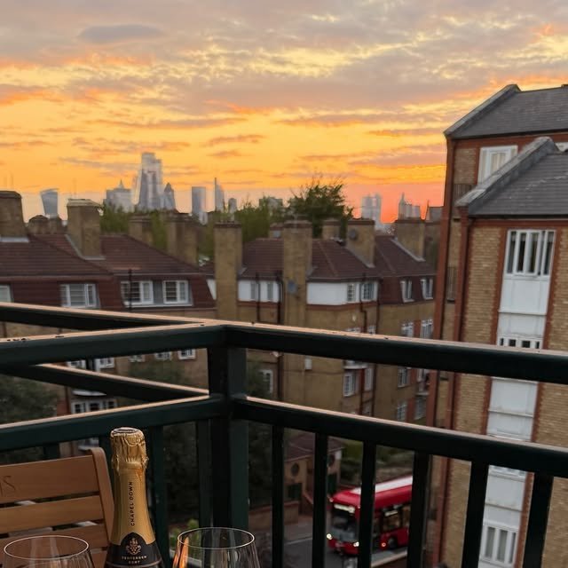 Candlelit dinner for two on a balcony at sunset