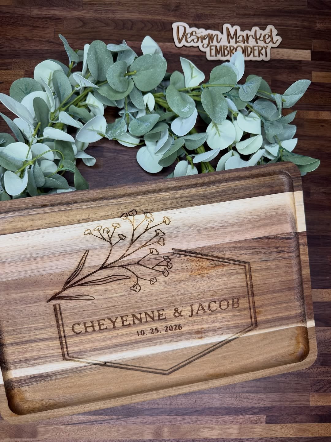Engraved wooden cutting board on kitchen table