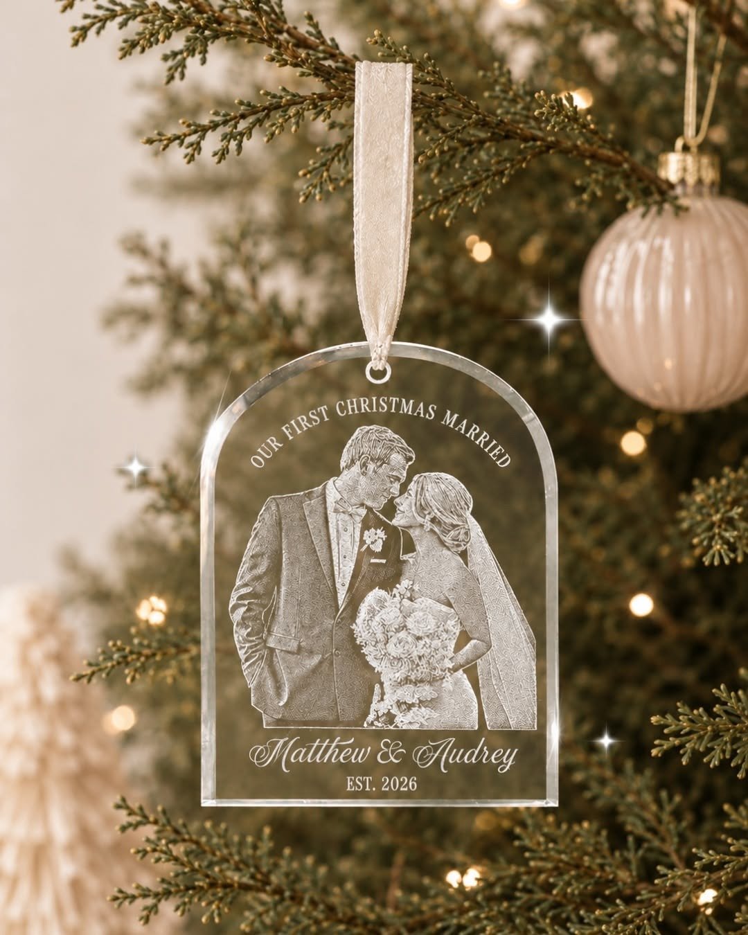 Engraved first Christmas ornament on tree