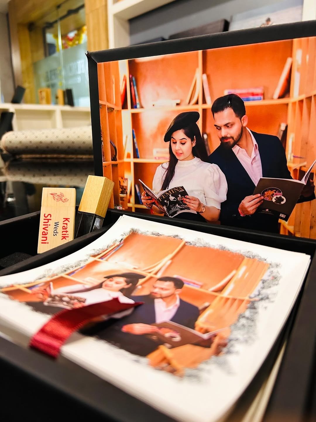 Open wedding photo album in keepsake box