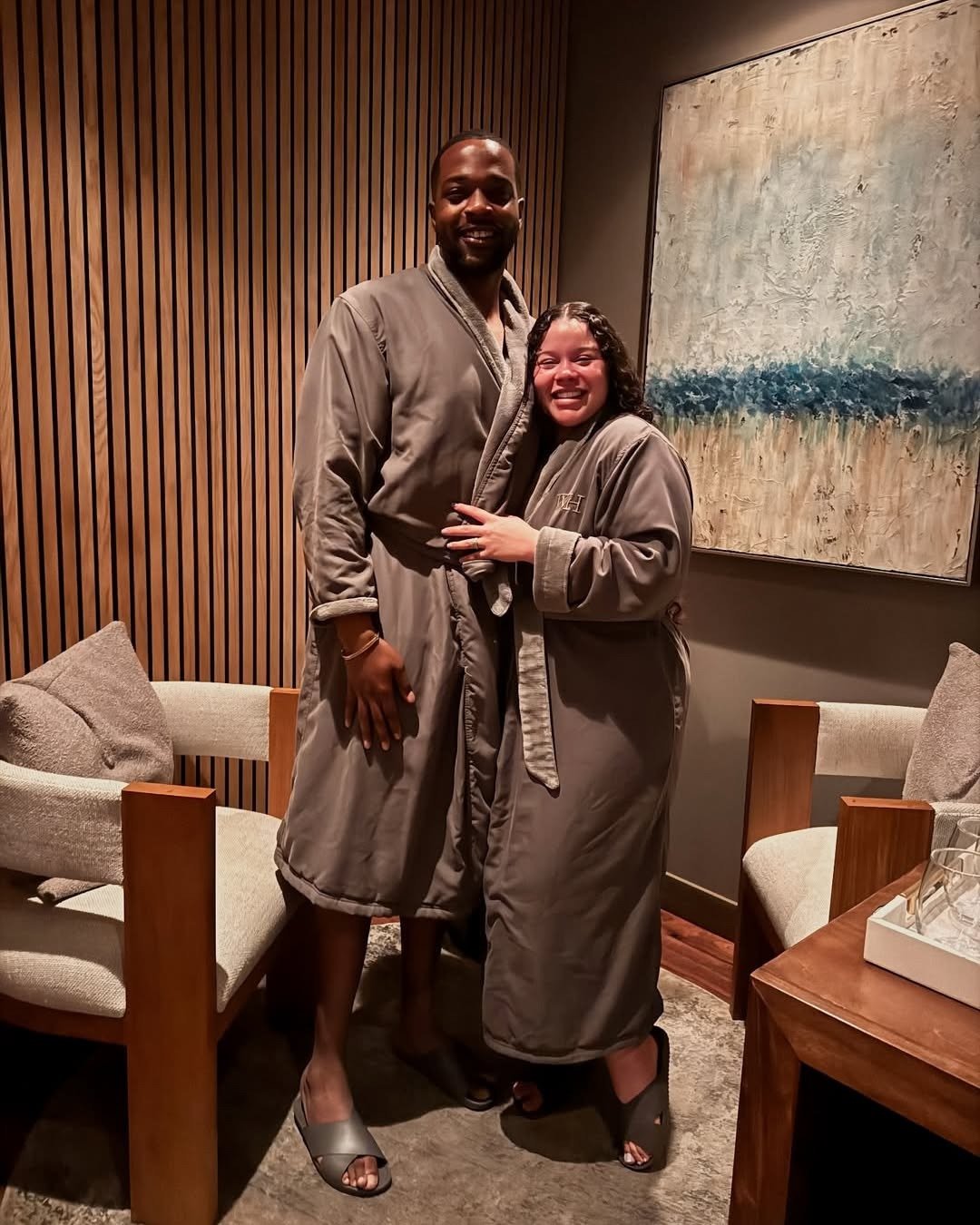 Couple in spa robes in relaxation lounge