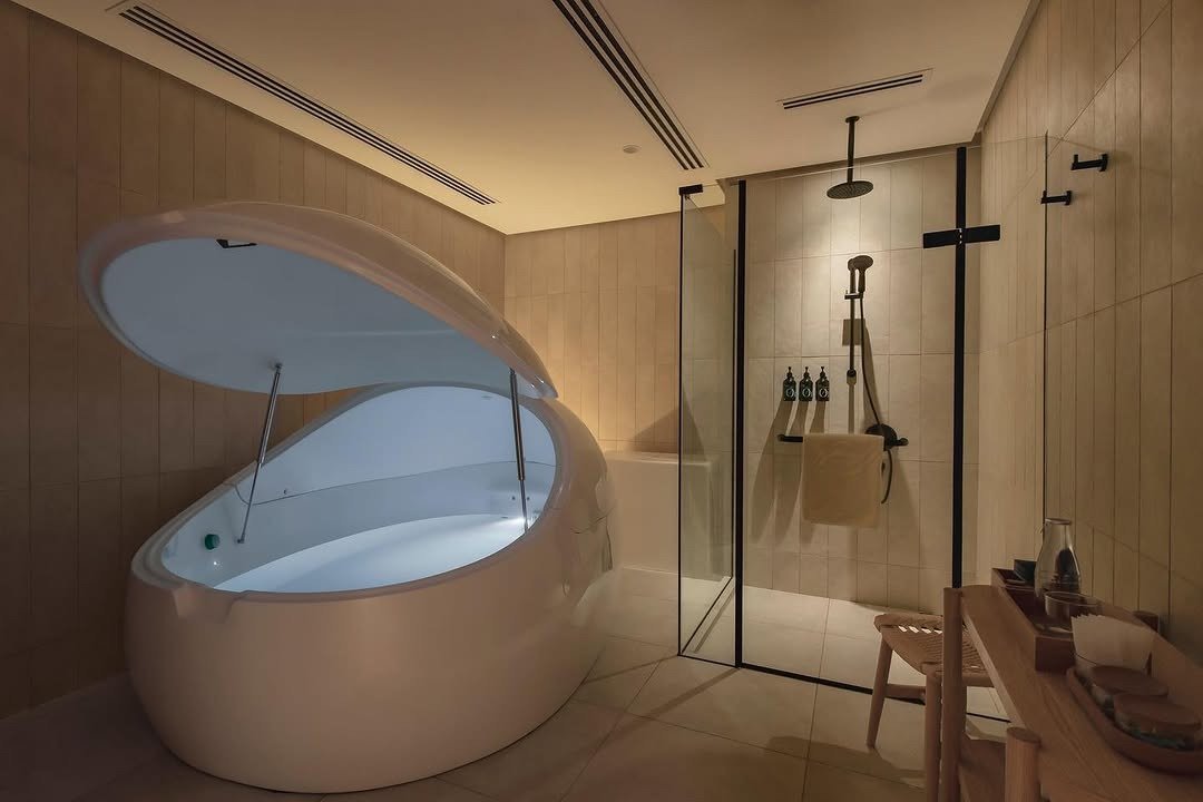 White floatation pod open in spa room