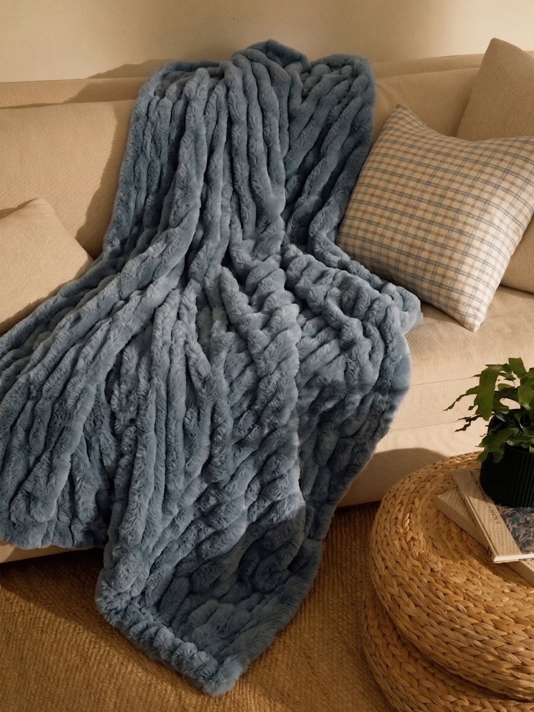 Plush throw blanket draped over a sofa
