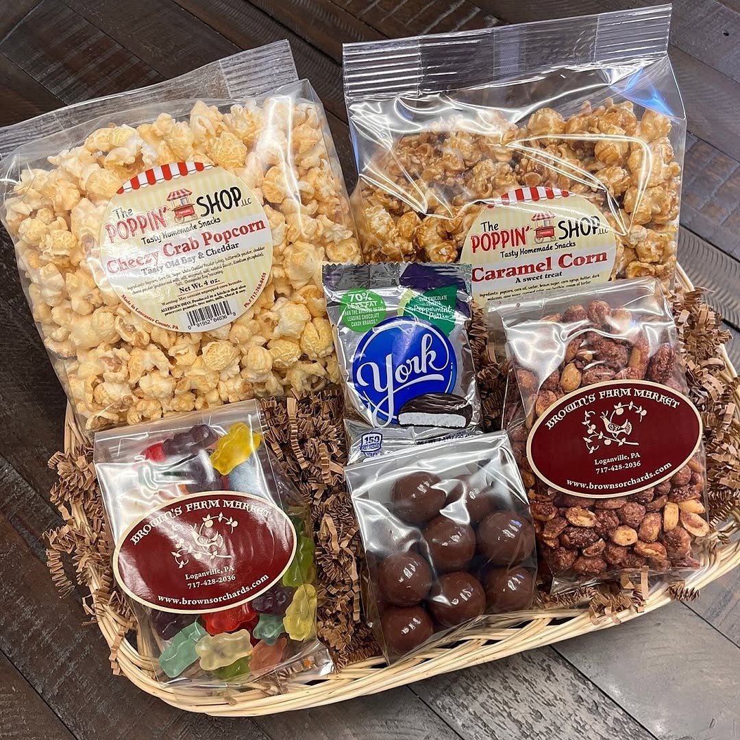 Wicker basket with popcorn, candy and nuts