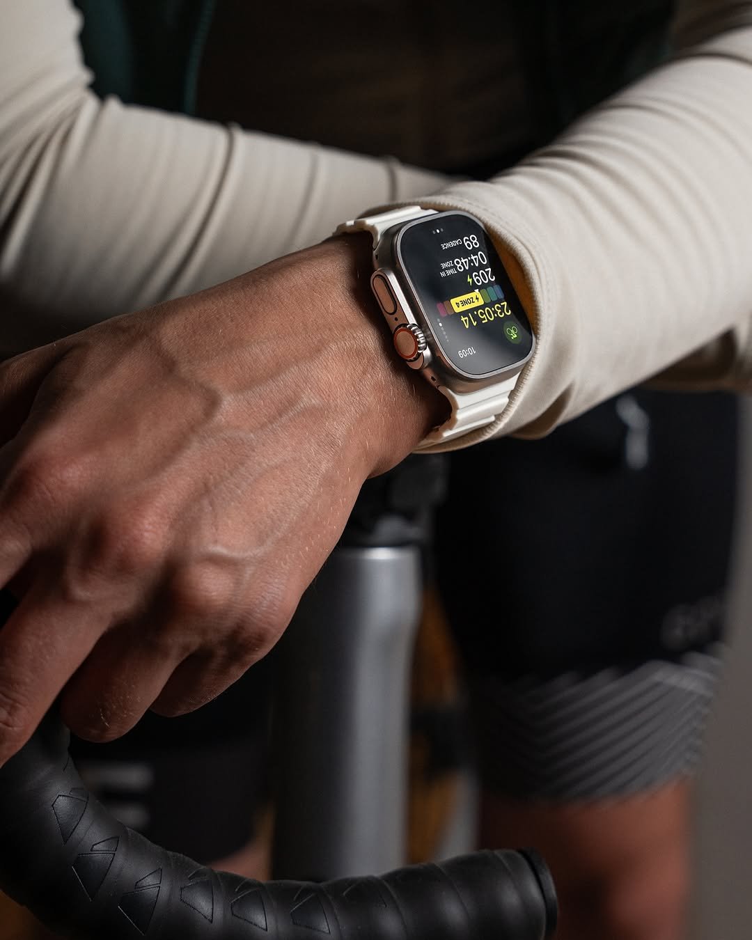 Man's wrist with smartwatch on a bicycle ride