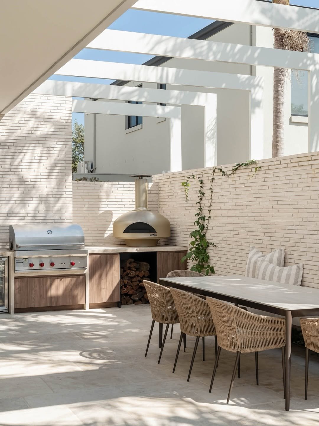 Backyard pizza oven in outdoor kitchen