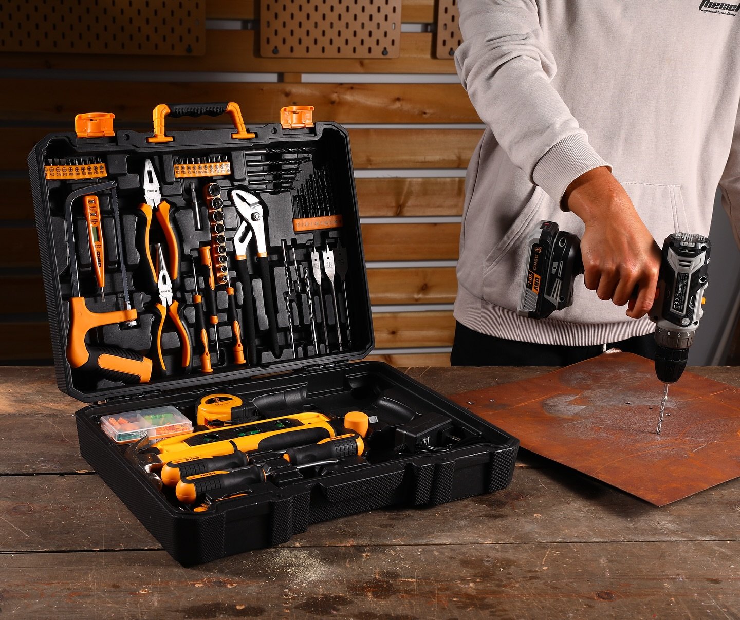 Cordless drill in use with open tool kit