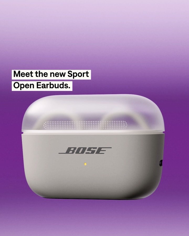 Bose Sport Open Earbuds in charging case on purple background