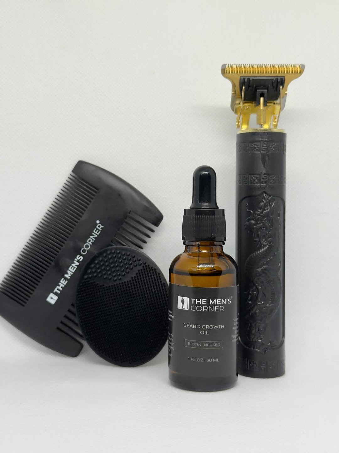 Men's beard grooming kit with trimmer and accessories on white