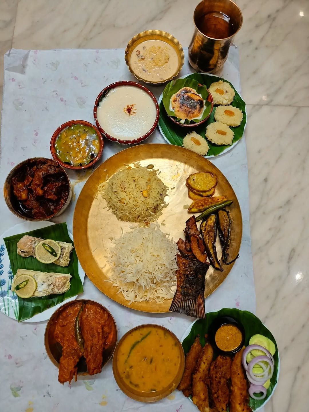Homemade dinner thali with curries and sweets at home