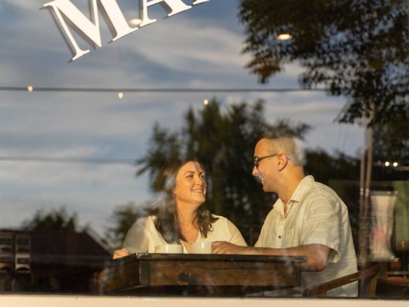 Couple talking together over coffee at a cafe