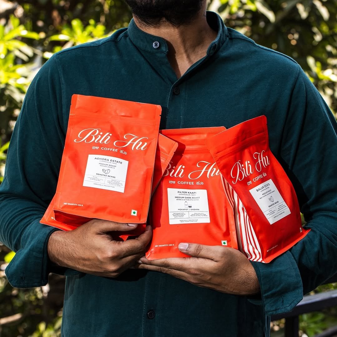 Man holding bags of single-origin coffee