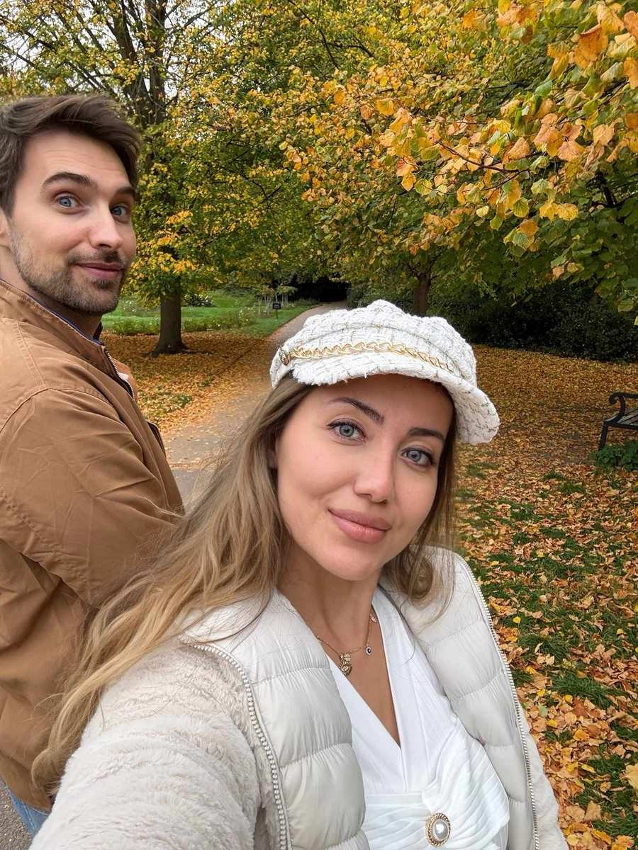 Couple's selfie surrounded by golden autumn foliage