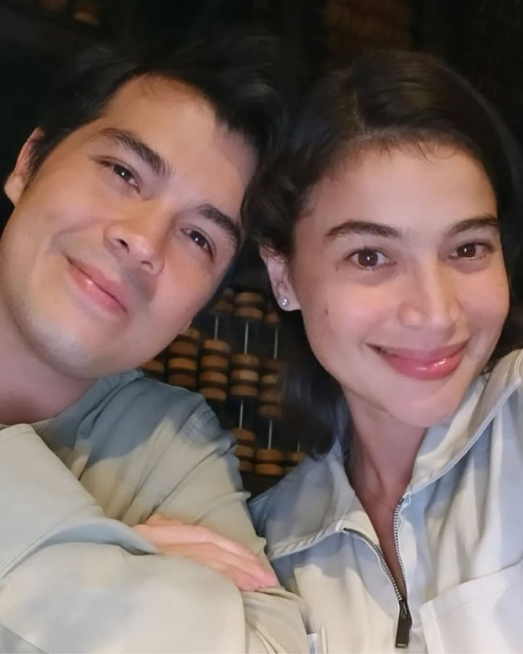 Smiling couple taking a selfie on a parents' date night out