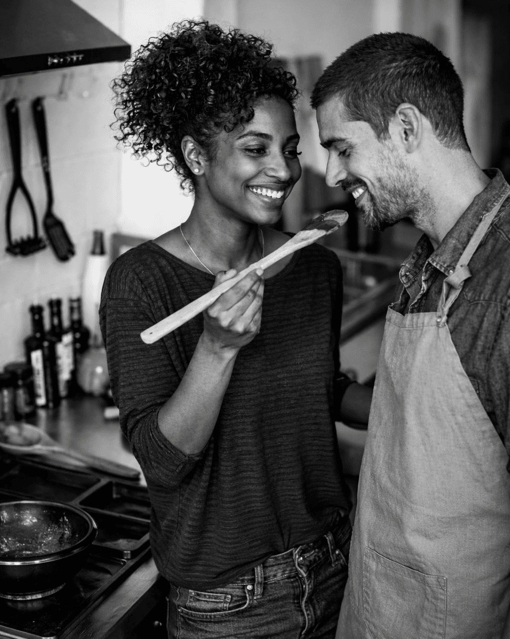 Happy couple cooking together in a home kitchen