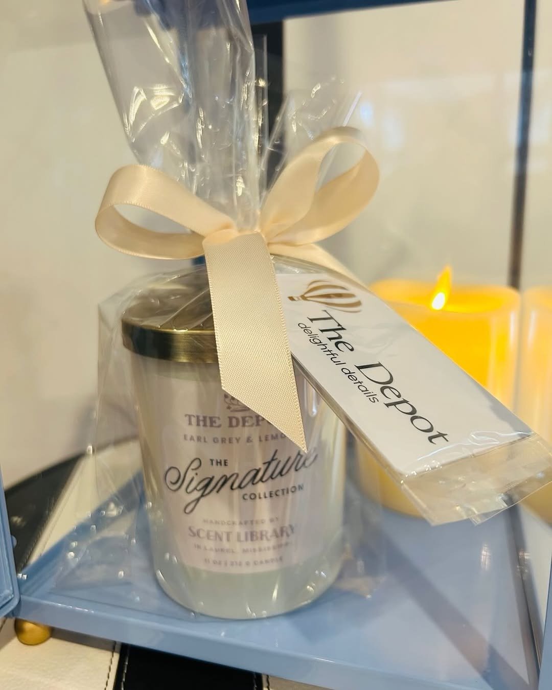 Candle gift wrapped with gift certificate tag