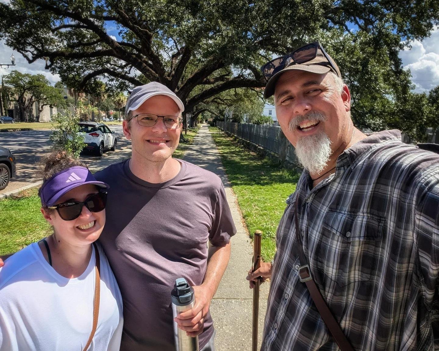 Couple with ghost tour guide on an old street at night