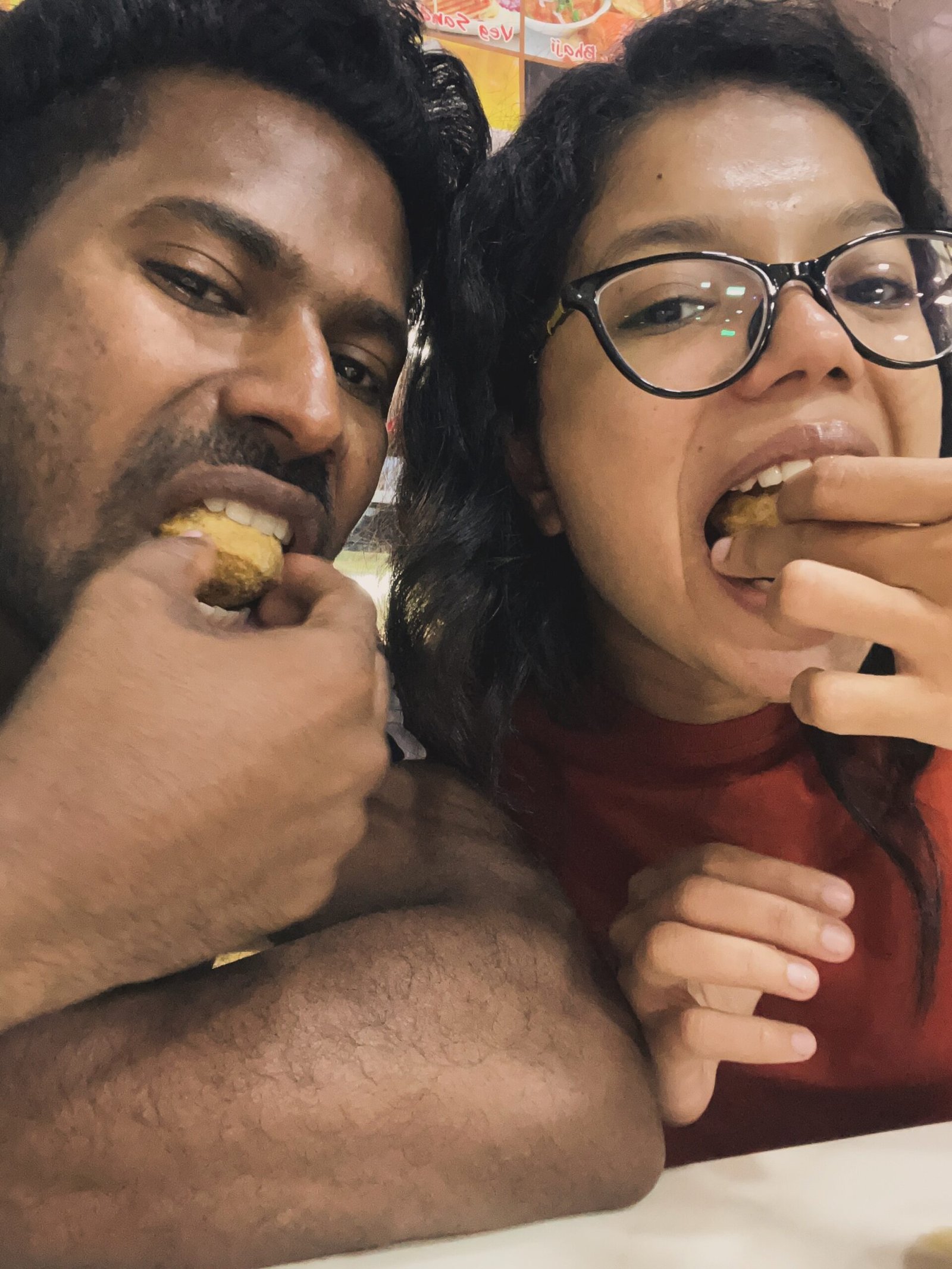Couple selfie eating street food snacks