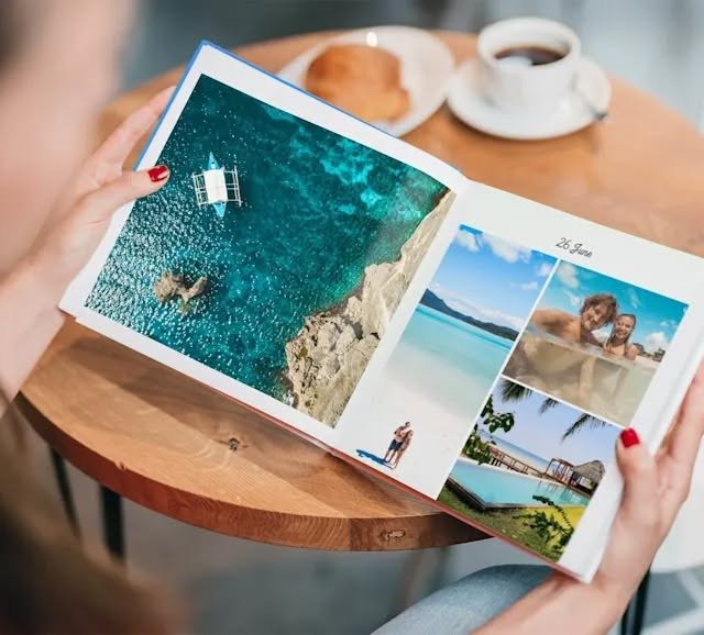 Open custom photo book with travel and couple photos, from our gifts for wife guide