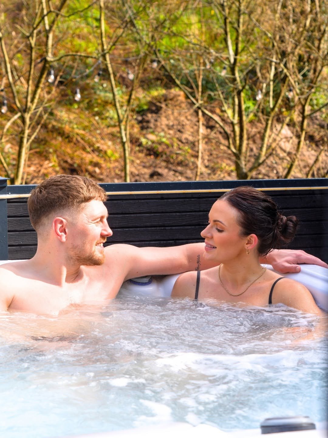 Couple relaxing in hotel hot tub