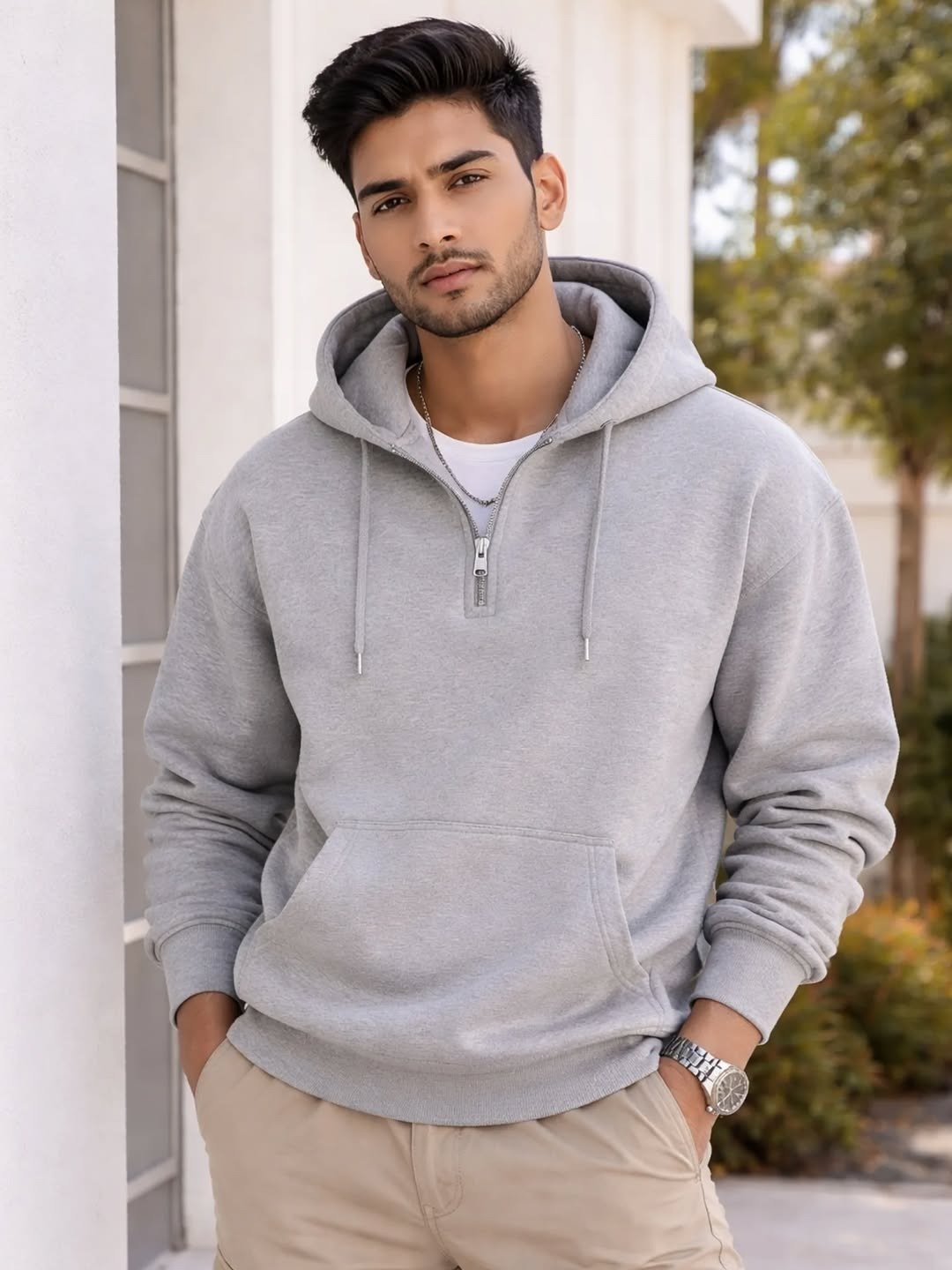 Man wearing light grey premium hoodie outdoors