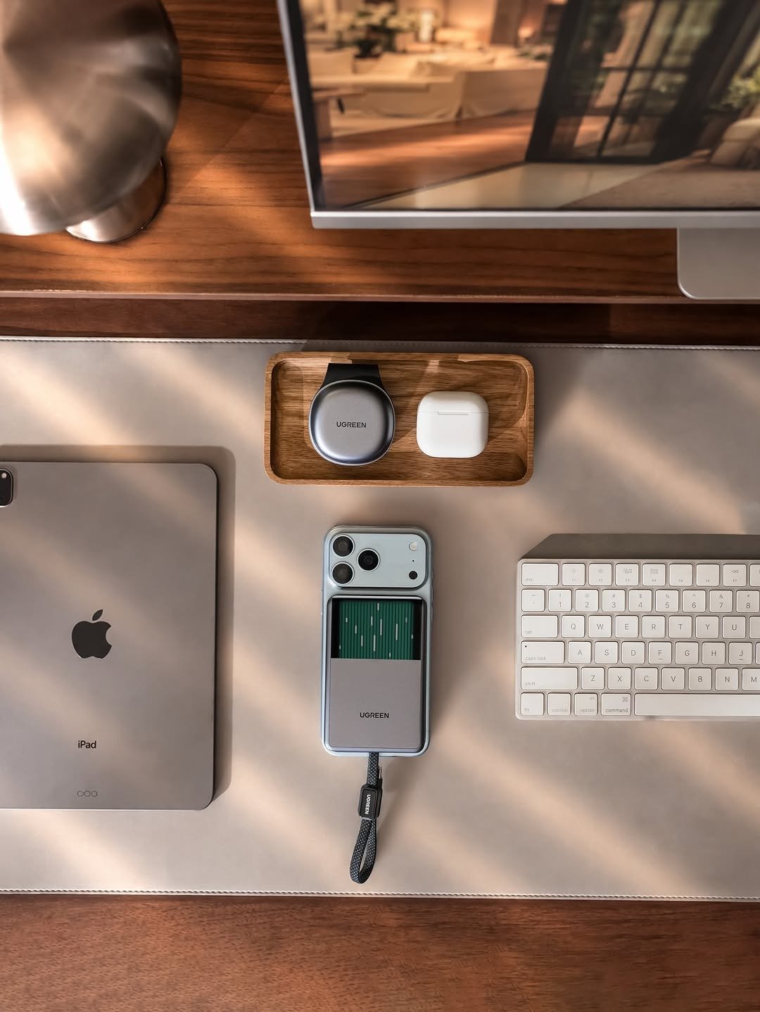 Magnetic power bank on iPhone in desk flat lay