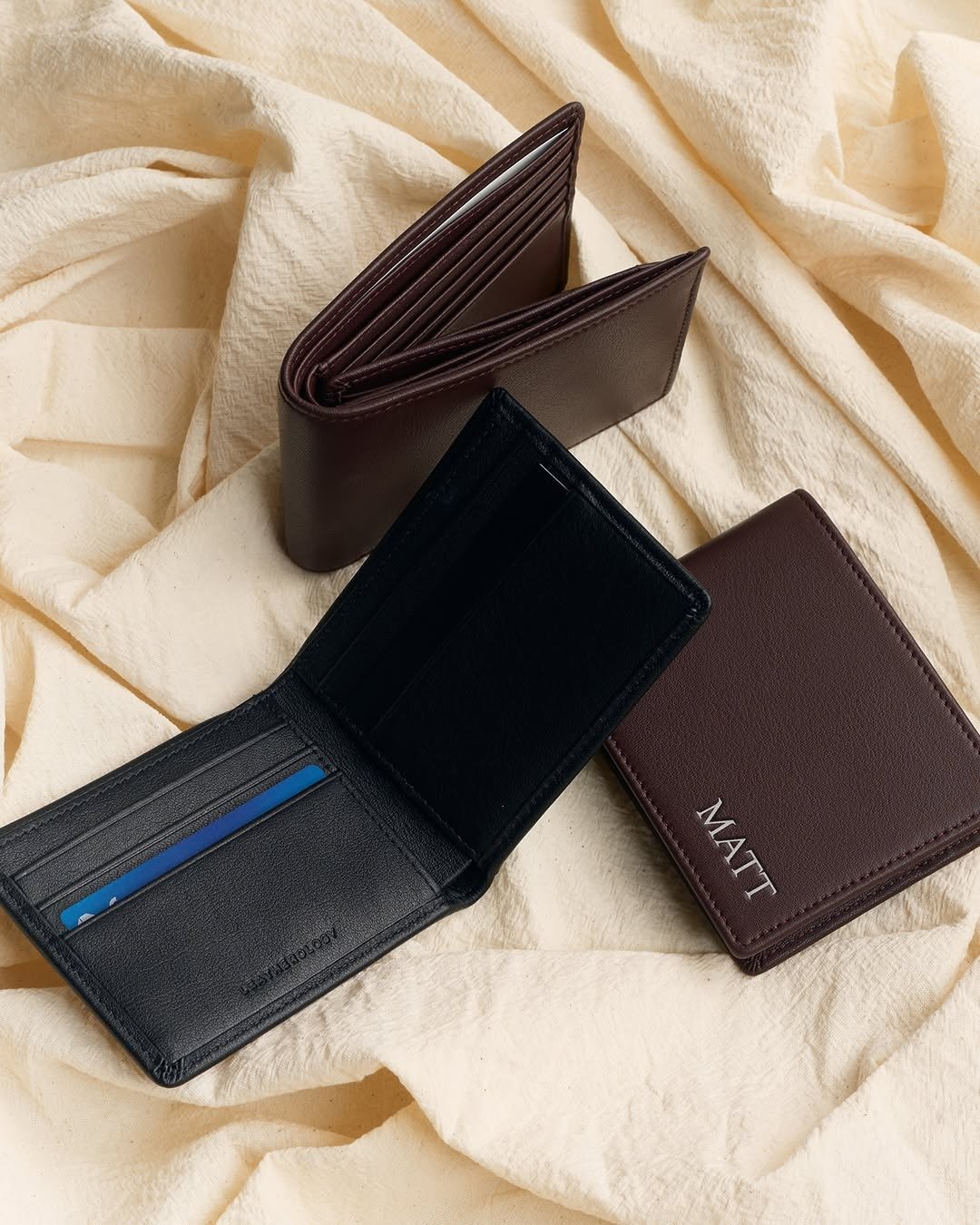 Leather wallets with one engraved with a name
