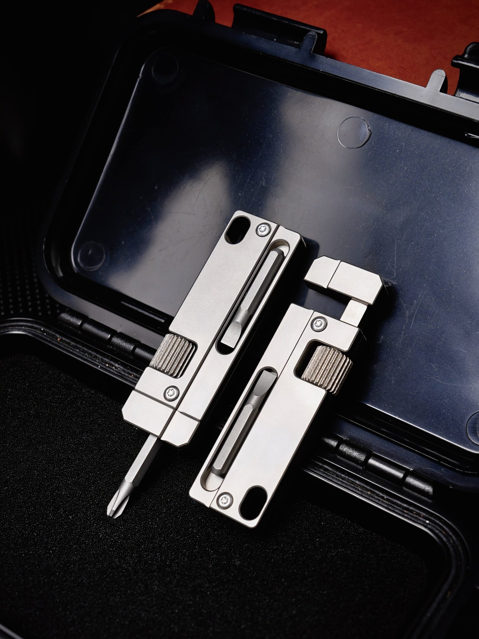 Titanium EDC multi-tools on open case