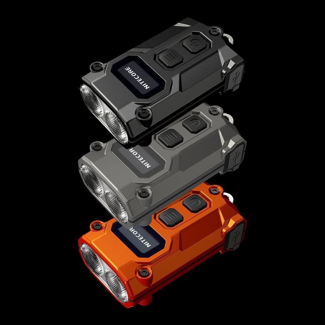 Three keychain flashlights on black background